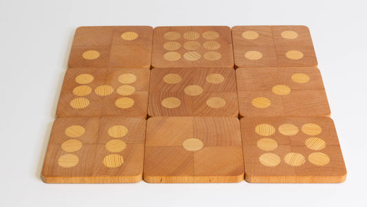 Wooden coasters arranged as a magic square